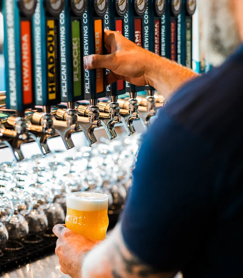 Pouring a pint at Pelican Brewing Yachats